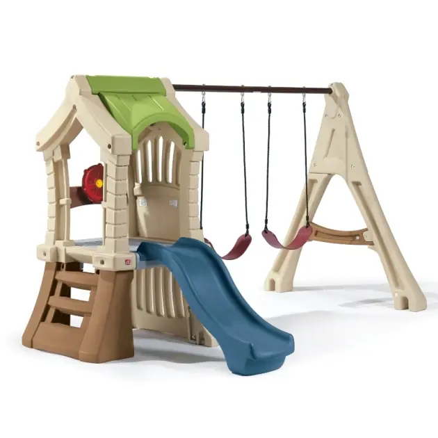 beige and green outdoor playhouse with swings and blue slide for kids