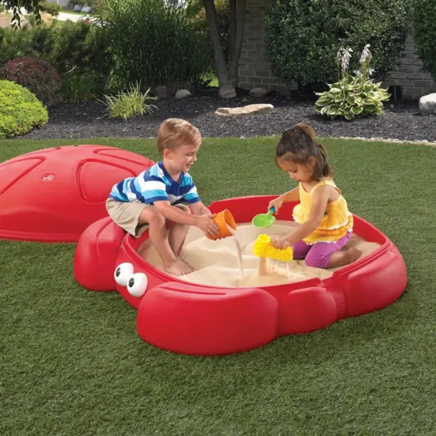 "Step2 Crabbie Sandbox with kids playing in red crab-shaped outdoor sandbox"