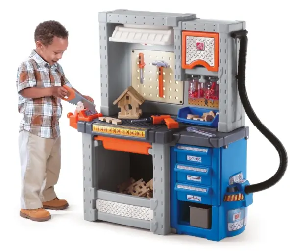 Child playing with Step2 Deluxe Workshop Playset featuring realistic toy tools at Butterflies Toys HSR Layout Bengaluru.