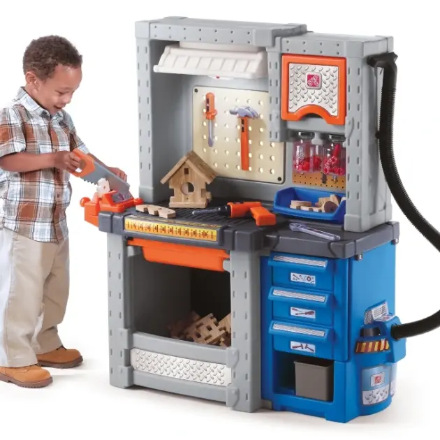 Child playing with Step2 Deluxe Workshop Playset featuring realistic toy tools at Butterflies Toys HSR Layout Bengaluru.
