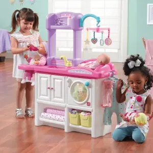 kids playing with Step2 baby doll nursery toy set