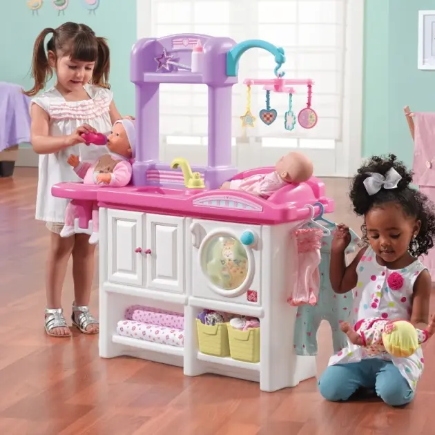 kids playing with Step2 baby doll nursery toy set