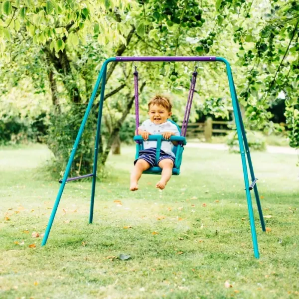 Plum® Metal 2-in-1 toddler swing set with steel frame and harness in outdoor garden